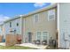 View of back of home and patio area with a grill and chairs at 11730 Chatham Dr, Hampton, GA 30228