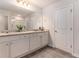 Bright bathroom featuring dual vanities, granite countertops, and a walk-in shower at 11730 Chatham Dr, Hampton, GA 30228