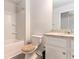 This bathroom has gray plank flooring, and granite countertops at 11730 Chatham Dr, Hampton, GA 30228