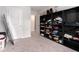 This walk-in closet has ample shelving and access to additional storage areas at 11730 Chatham Dr, Hampton, GA 30228