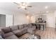 Comfortable living room with seating area, kitchen with bar seating, stainless appliances and modern design at 11730 Chatham Dr, Hampton, GA 30228