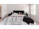 Nicely staged bedroom features a comfortable bed and dual nightstands at 11730 Chatham Dr, Hampton, GA 30228