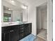 Bathroom featuring a dual sink vanity, a large mirror and a walk-in closet at 2396 Whiteoak Se Bnd # 16, Smyrna, GA 30080