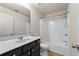 Clean bathroom with a shower-tub combo and dark wood vanity at 2396 Whiteoak Se Bnd # 16, Smyrna, GA 30080