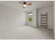 Neutral bedroom offers natural light, carpet, and a ladder shelf at 2396 Whiteoak Se Bnd # 16, Smyrna, GA 30080