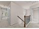 Upstairs hallway features carpet and wood railing, leading to multiple rooms at 2396 Whiteoak Se Bnd # 16, Smyrna, GA 30080
