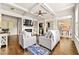 Open concept living room features modern decor, fireplace, and seamless flow to dining area at 2396 Whiteoak Se Bnd # 16, Smyrna, GA 30080