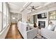 Bright living room with a fireplace, coffered ceilings, and hardwood floors at 2396 Whiteoak Se Bnd # 16, Smyrna, GA 30080