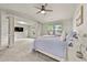 Bright primary bedroom boasts plush carpet, a ceiling fan, and plenty of natural light at 2396 Whiteoak Se Bnd # 16, Smyrna, GA 30080