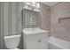 Bathroom featuring a vanity, tiled shower and bathtub with a tiled surround and wall stripes at 435 Grenock Cir, Atlanta, GA 30328