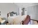 Serene bedroom with neutral walls, a dark wood bed frame, and a view to the outside at 435 Grenock Cir, Atlanta, GA 30328