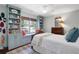 Comfortable bedroom with built-in shelving, a window seat, and soft natural light at 435 Grenock Cir, Atlanta, GA 30328