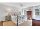 Bright bedroom with neutral walls, hardwood floors, and natural light from multiple windows at 435 Grenock Cir, Atlanta, GA 30328