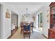 Open concept dining room features a decorative chandelier and sliding doors at 435 Grenock Cir, Atlanta, GA 30328