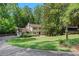 Traditional two-story home with a well-manicured lawn, mature trees, and an inviting front entrance at 435 Grenock Cir, Atlanta, GA 30328