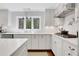 Well-appointed kitchen featuring white cabinets, sleek countertops, and stainless steel appliances at 435 Grenock Cir, Atlanta, GA 30328