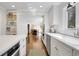 Modern kitchen featuring stainless steel appliances, white cabinetry, and an open layout for seamless entertaining at 435 Grenock Cir, Atlanta, GA 30328