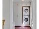 Convenient laundry area with stacked washer and dryer, plus ample storage cabinets at 435 Grenock Cir, Atlanta, GA 30328