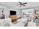 Spacious living room that opens to the bright kitchen with stainless appliances and island seating at 435 Grenock Cir, Atlanta, GA 30328