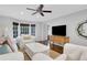 Comfortable living room featuring large windows, hardwood floors, and stylish furnishings at 435 Grenock Cir, Atlanta, GA 30328