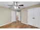 Bedroom with hardwood floors, closet, and attached bath at 5115 Amberden Hall Dr, Suwanee, GA 30024