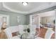 Elegant dining room with hardwood floors, wainscoting, and a neutral color palette at 5115 Amberden Hall Dr, Suwanee, GA 30024