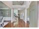Grand foyer with hardwood floors, a staircase, and natural light from the large windows at 5115 Amberden Hall Dr, Suwanee, GA 30024