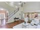 Bright entryway with high ceilings, hardwood floors, and staircase at 5115 Amberden Hall Dr, Suwanee, GA 30024