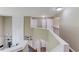 Spacious hallway offers built-in shelving and access to multiple rooms at 5115 Amberden Hall Dr, Suwanee, GA 30024