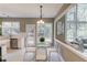 Kitchen nook area with stainless steel appliances, a breakfast table, and lots of natural light at 5115 Amberden Hall Dr, Suwanee, GA 30024