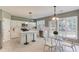 Eat-in kitchen with a kitchen island, stainless steel appliances, and natural light at 5115 Amberden Hall Dr, Suwanee, GA 30024