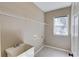 Spacious laundry room includes a utility sink, tile floor, and wire shelving at 5115 Amberden Hall Dr, Suwanee, GA 30024