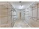 Spacious walk-in closet with built-in shelving and ample storage space at 5115 Amberden Hall Dr, Suwanee, GA 30024