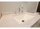 Close-up of bathroom vanity with chrome faucet and solid surface countertop at 537 Eastside Dr, Dacula, GA 30019