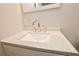 Bathroom vanity featuring a solid surface countertop, sink, and chrome faucet at 537 Eastside Dr, Dacula, GA 30019