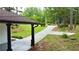 View of the paved driveway and grassy front lawn at 537 Eastside Dr, Dacula, GA 30019