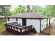 Aerial view of the exterior of the home with a deck and ample backyard space at 537 Eastside Dr, Dacula, GA 30019