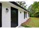 Close-up of the front door, showcasing the fresh exterior paint and updated fixtures at 537 Eastside Dr, Dacula, GA 30019
