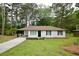 Inviting front exterior of a white home with a well-manicured lawn and traditional design at 537 Eastside Dr, Dacula, GA 30019