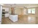 A kitchen and living room combination featuring granite countertops, stainless steel appliances, and pendant lighting at 537 Eastside Dr, Dacula, GA 30019