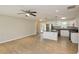 Open-concept kitchen and living area with stainless appliances, modern cabinets, and French doors to patio at 537 Eastside Dr, Dacula, GA 30019