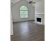 Spacious living room with fireplace and large window for natural light at 5709 Newnan Cir, Austell, GA 30106