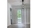 Bright living area featuring modern lighting and sliding door to balcony at 5709 Newnan Cir, Austell, GA 30106