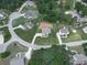 Aerial view of a neighborhood featuring spacious lots, tree coverage, and winding roads at 114 Saddle Wood Dr, Dallas, GA 30157