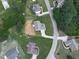 An aerial view of a home situated on a large lot with mature trees and well-maintained landscaping at 114 Saddle Wood Dr, Dallas, GA 30157