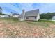 Rear view of a home with a chimney and a large backyard ready for your creative touch at 114 Saddle Wood Dr, Dallas, GA 30157