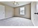 Spacious bedroom with neutral walls, carpeted floor, and good natural light at 114 Saddle Wood Dr, Dallas, GA 30157