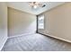 Neutral bedroom with carpeted floors, ceiling fan, and a window allowing natural light at 114 Saddle Wood Dr, Dallas, GA 30157