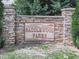 Stone community entrance sign for Saddlewood Farms, surrounded by lush greenery at 114 Saddle Wood Dr, Dallas, GA 30157
