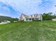 Exterior of beautiful home with well-maintained lawn and landscaping on a sunny day at 114 Saddle Wood Dr, Dallas, GA 30157